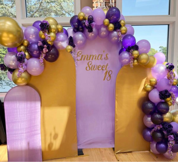 the Brat Shack backdrop with flowers for party