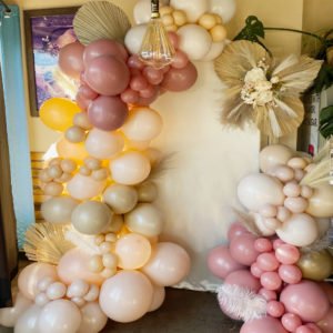 Boho natural wall panel with balloon garland the brat shack